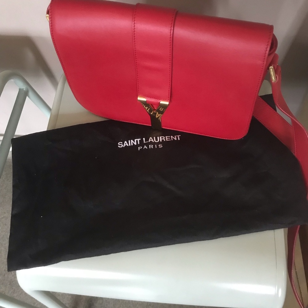 Gently used red YSL cross body bag.